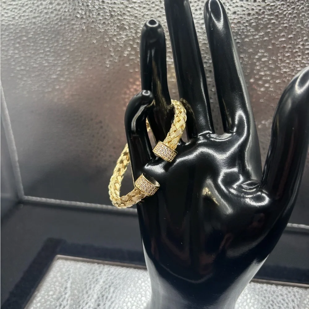 Elegant Gold Braided Also Adjustable Bangle .